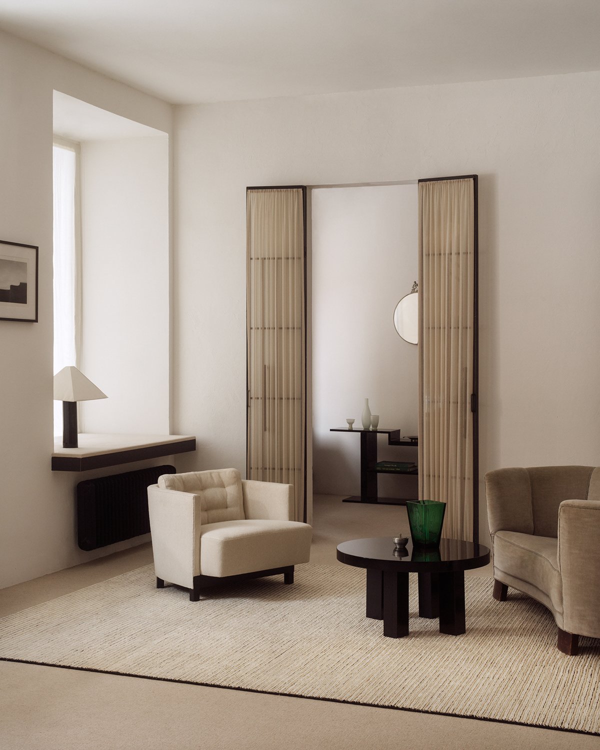 Twin 01 flatweave rug photographed in a stylish living room with neutral colored furniture in Stockholm, Sweden.