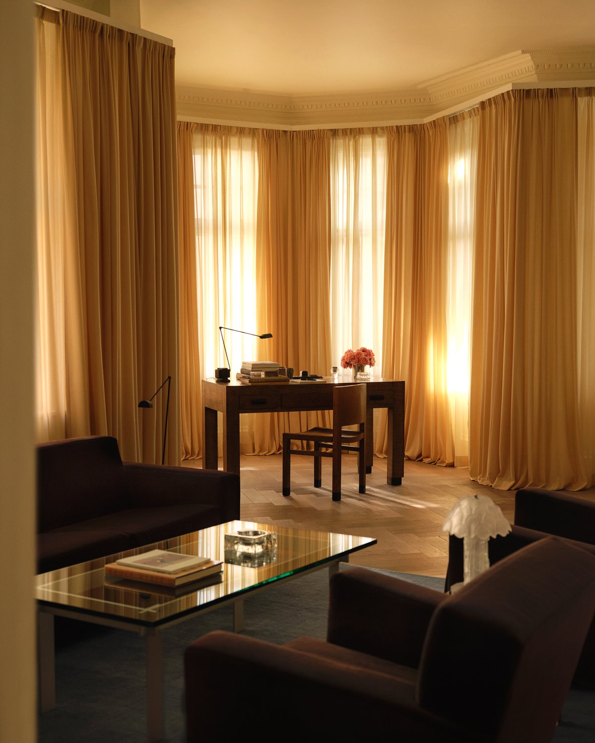 A sunlit corner in the Nordic Knots store on Mount Street in London, framed by Leo curtains and styled with a simple desk setting for a warm, serene mood.