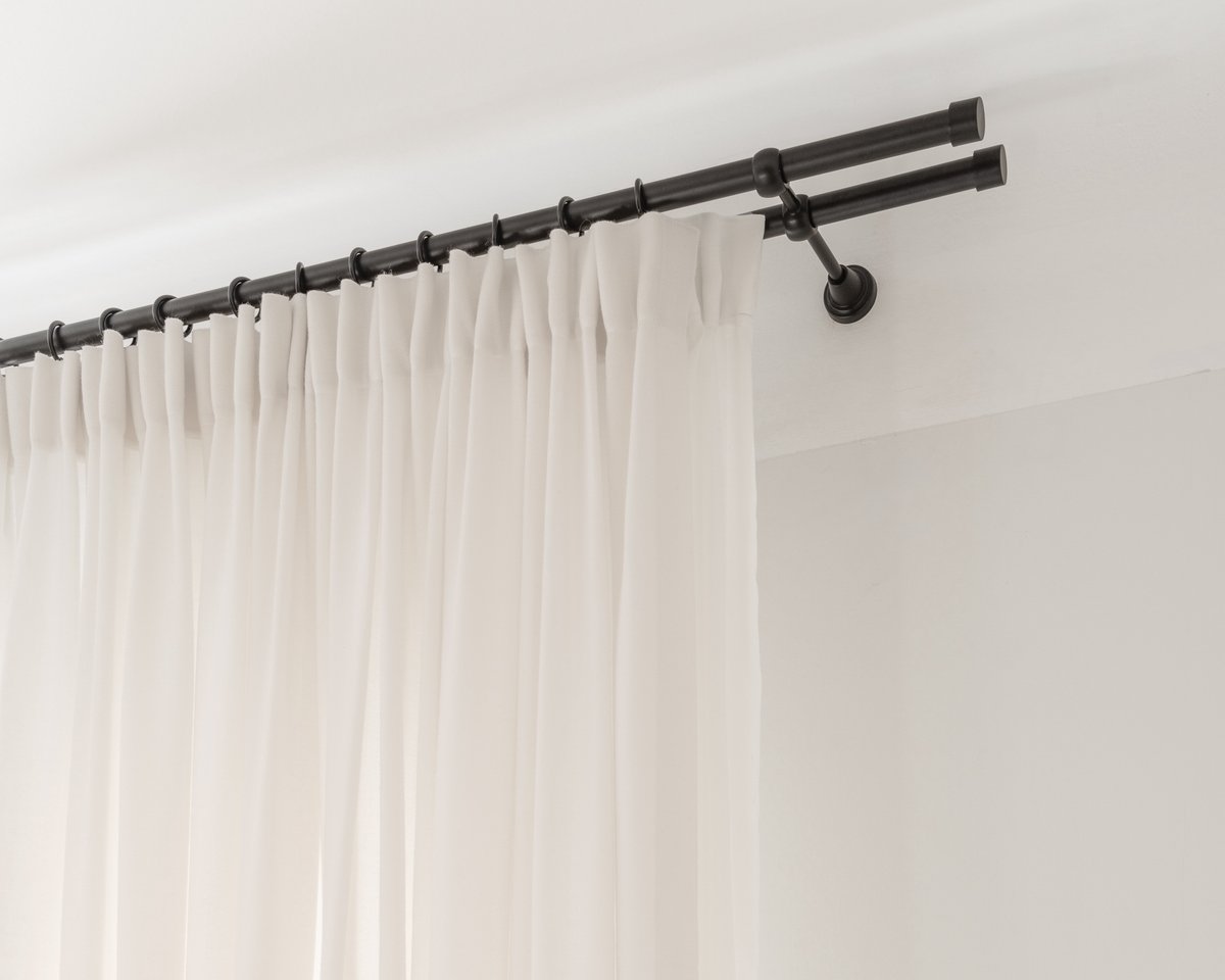 The Grand wool curtains installed on a double rod.