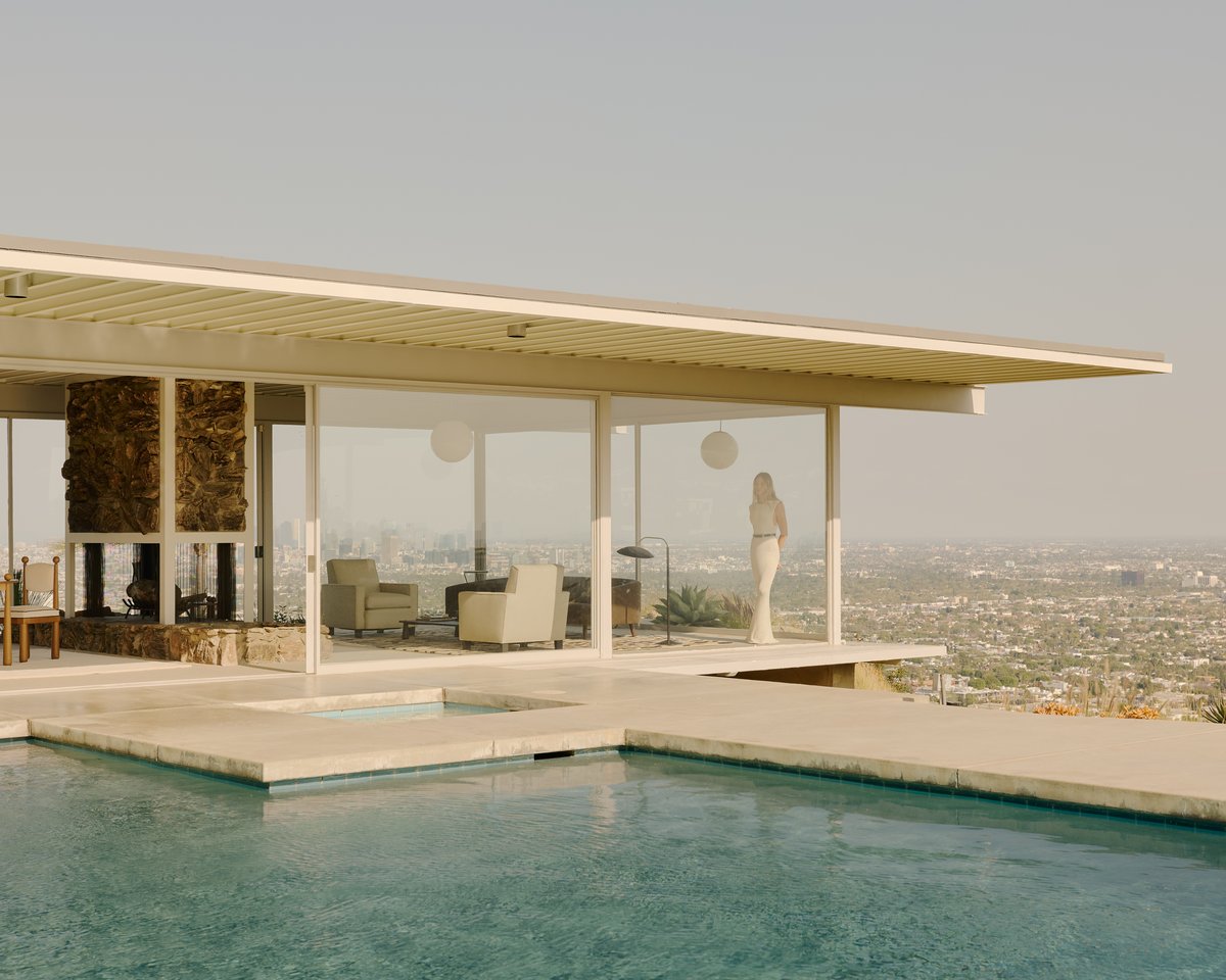 Jessie Andrews pictured in the background of Stahl House in Los Angeles.