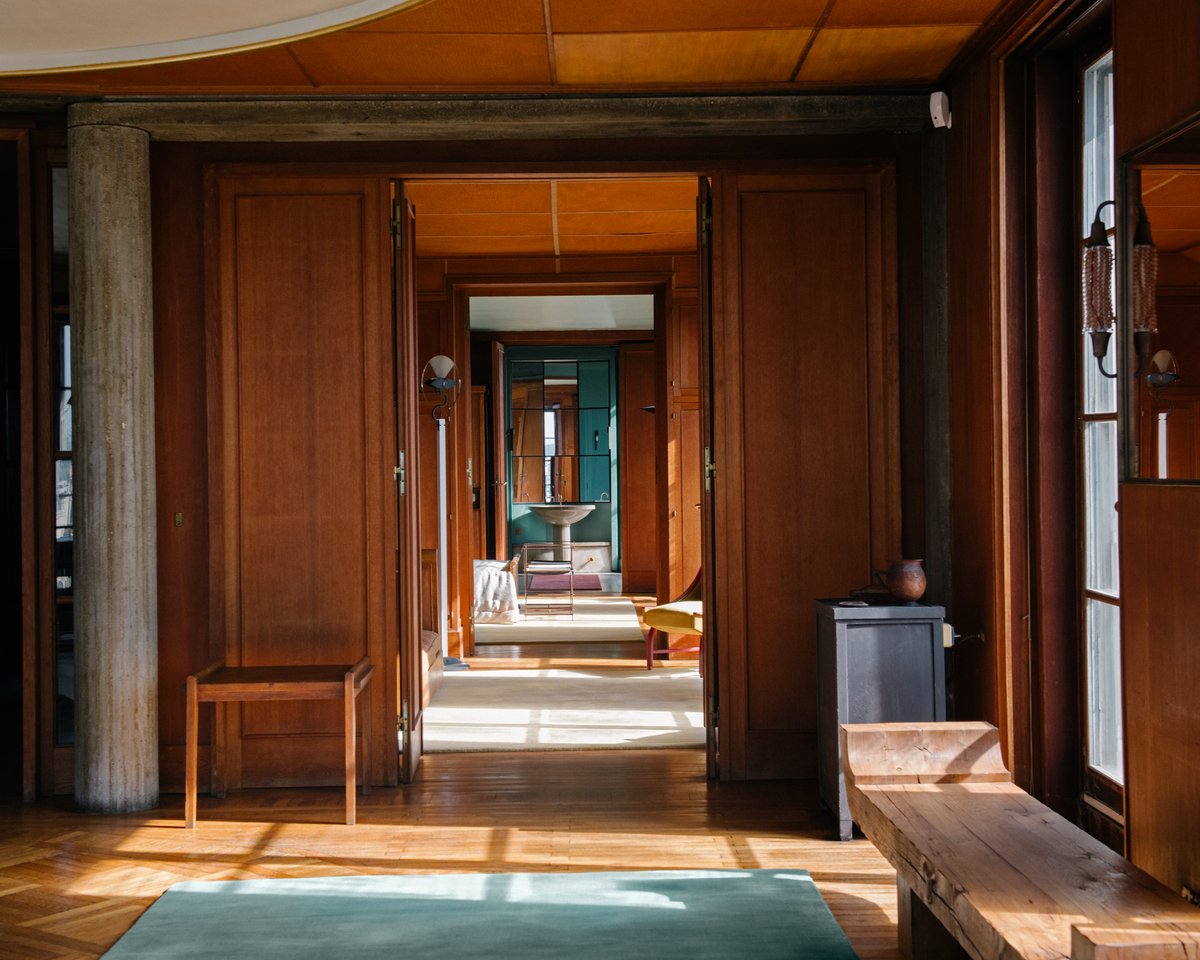 Grand Pale Green rug pictured in a wooden Parisian apartment.