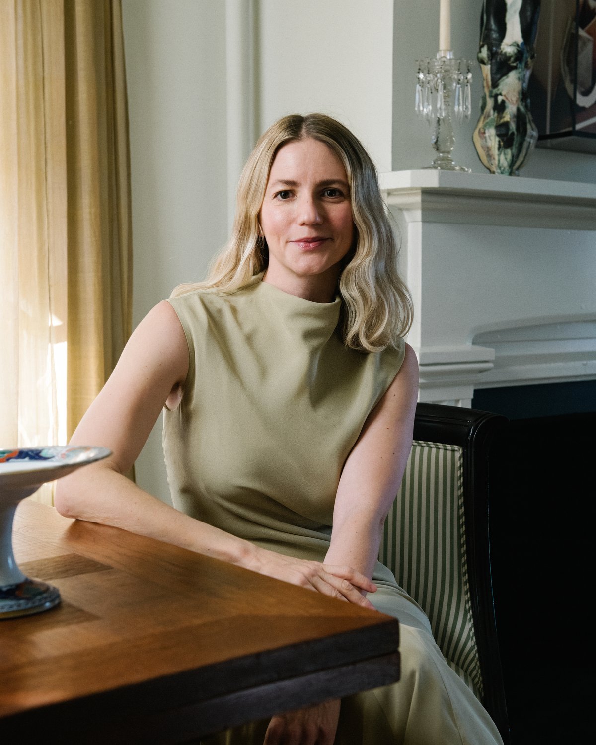 A portrait of the interior designer Michelle R. Smith, introducing four rugs in collaboration with Nordic Knots.