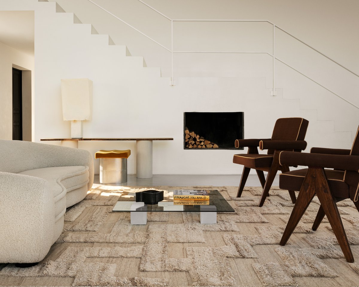 Boho Cream Mix rug pictured in a modern living room with a white stairs in the background.