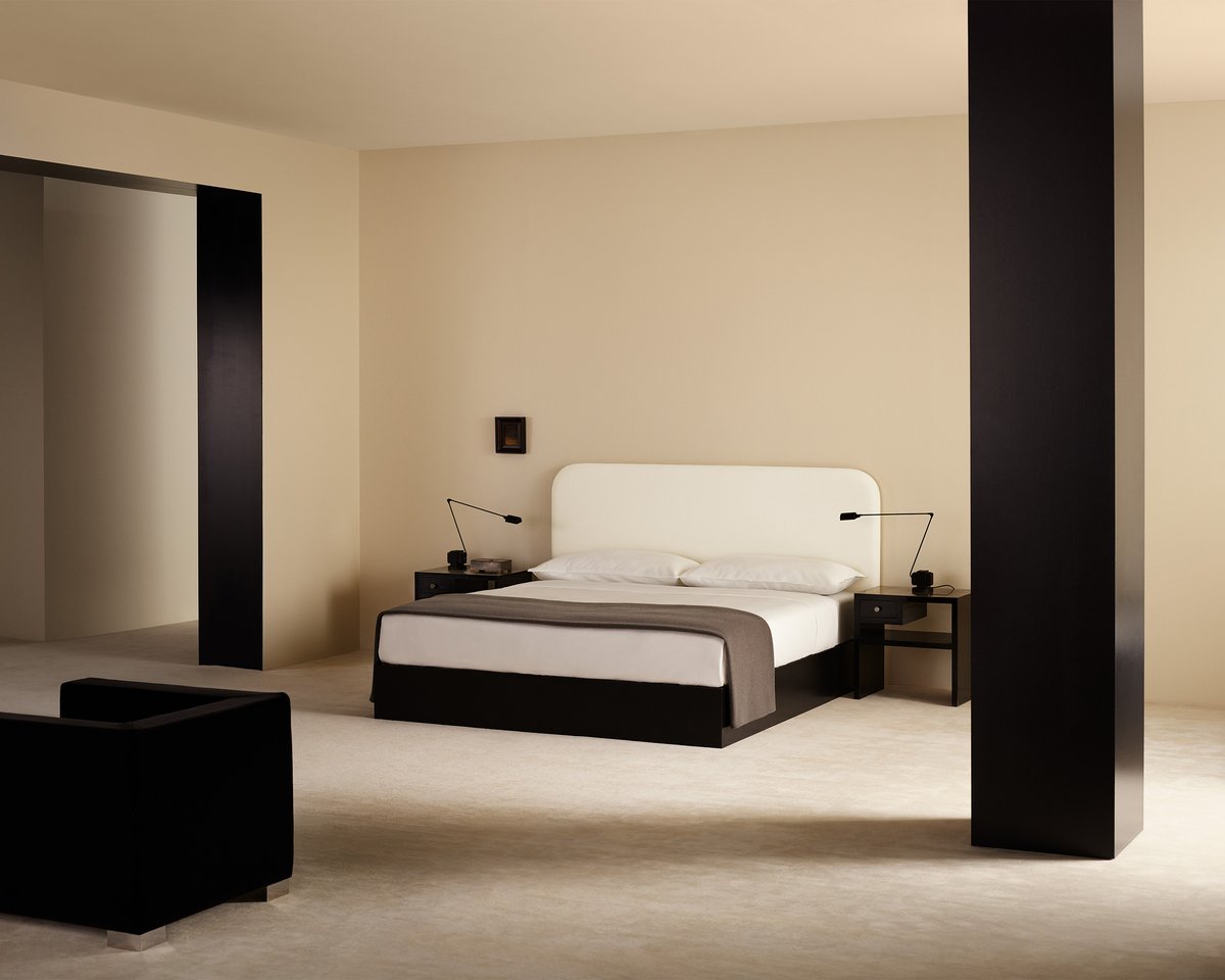 Bed styled with the Signature Headboard in Warm White, dressed in Crisp White bedding, finished with the Heritage Throw in Taupe.