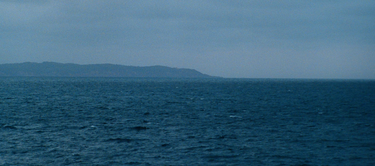 Ocean view with distant land on the horizon.