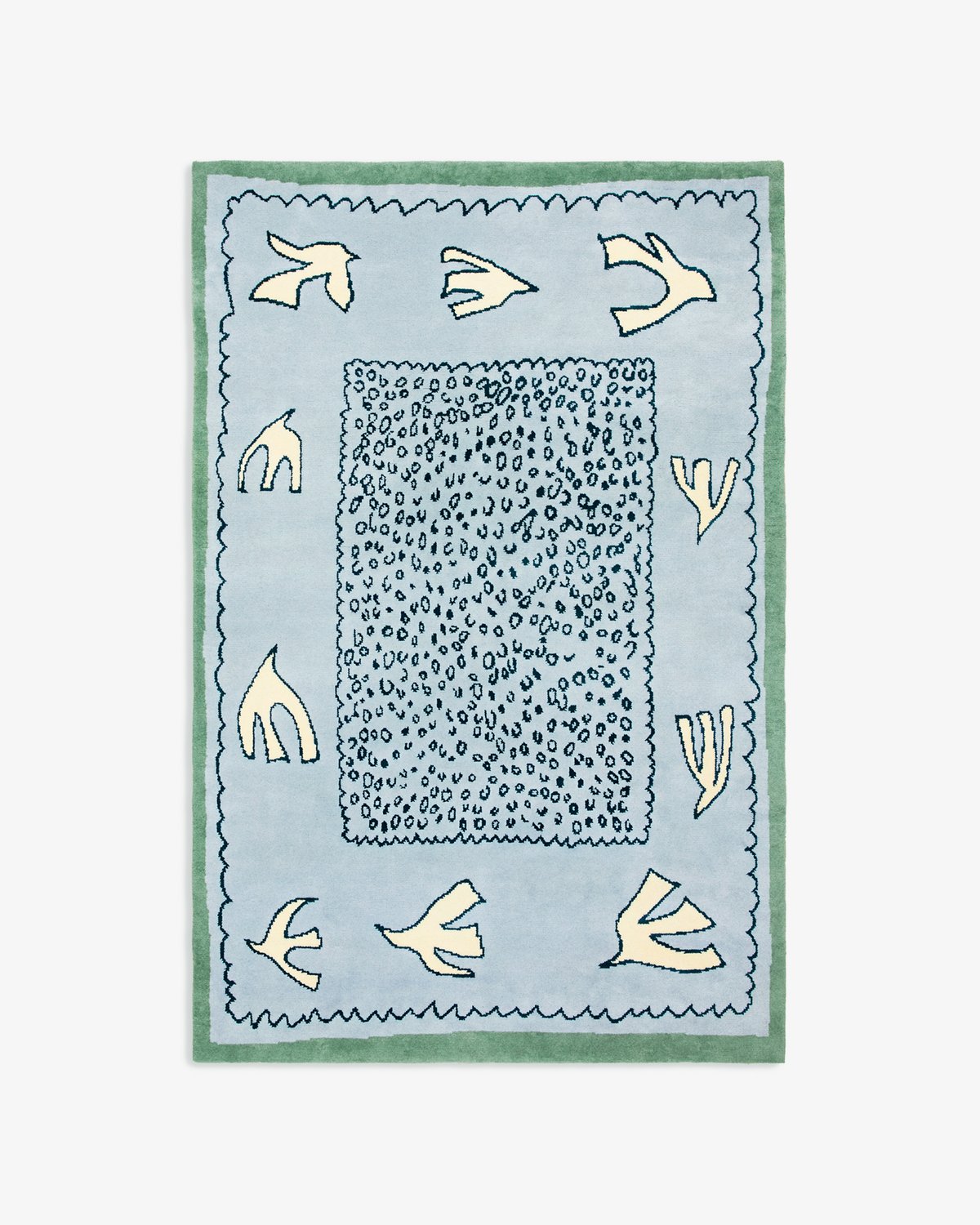 Product image of Columba in Blue. A soft wool rug in light blue with dove-like motifs and a green border, inspired by the calm of early summer skies.