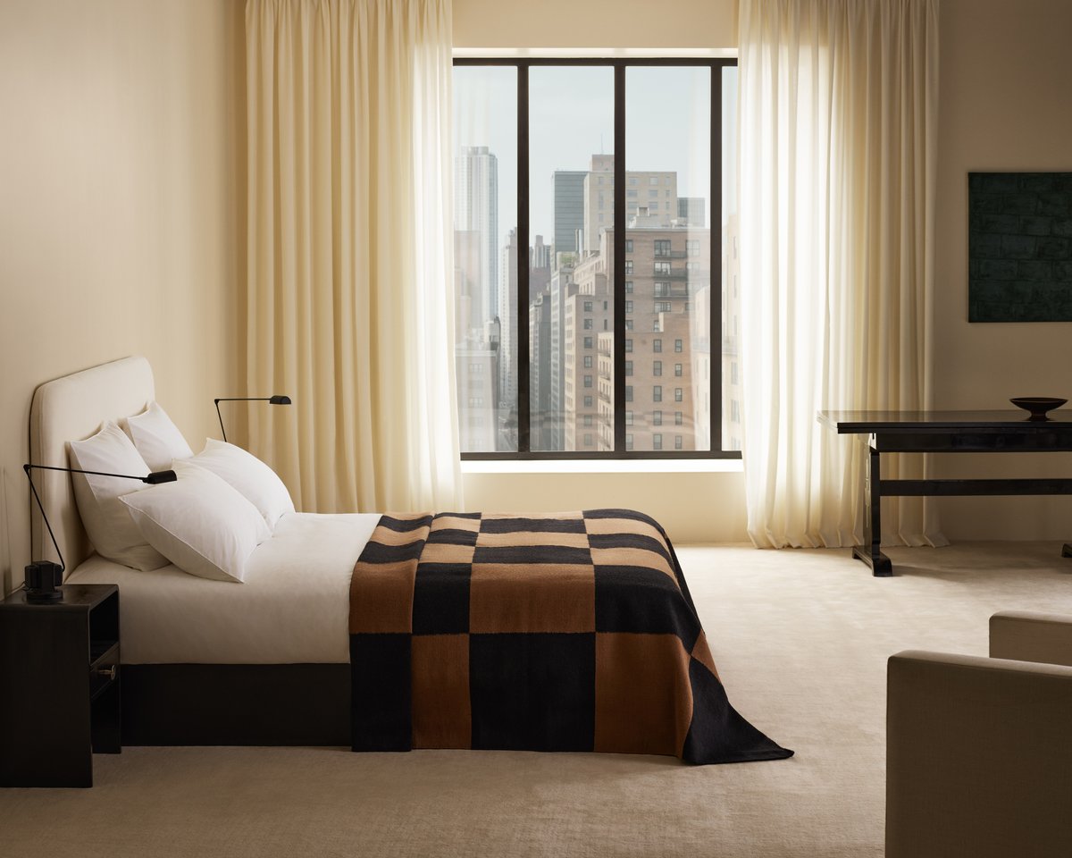 Bed styled with the Signature Headboard in Warm White, dressed in Crisp White bedding and the Square Kelim Bedspread in Tobacco.