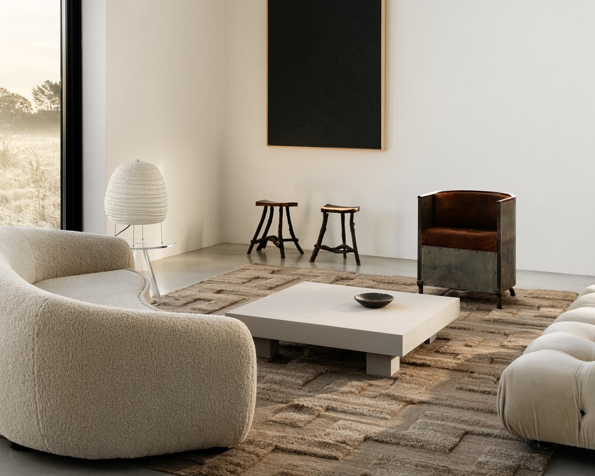 Shag wool rug Boho in Brown Mix pictured in a minimalistic living room with large windows and artistic interior design details in Sweden.