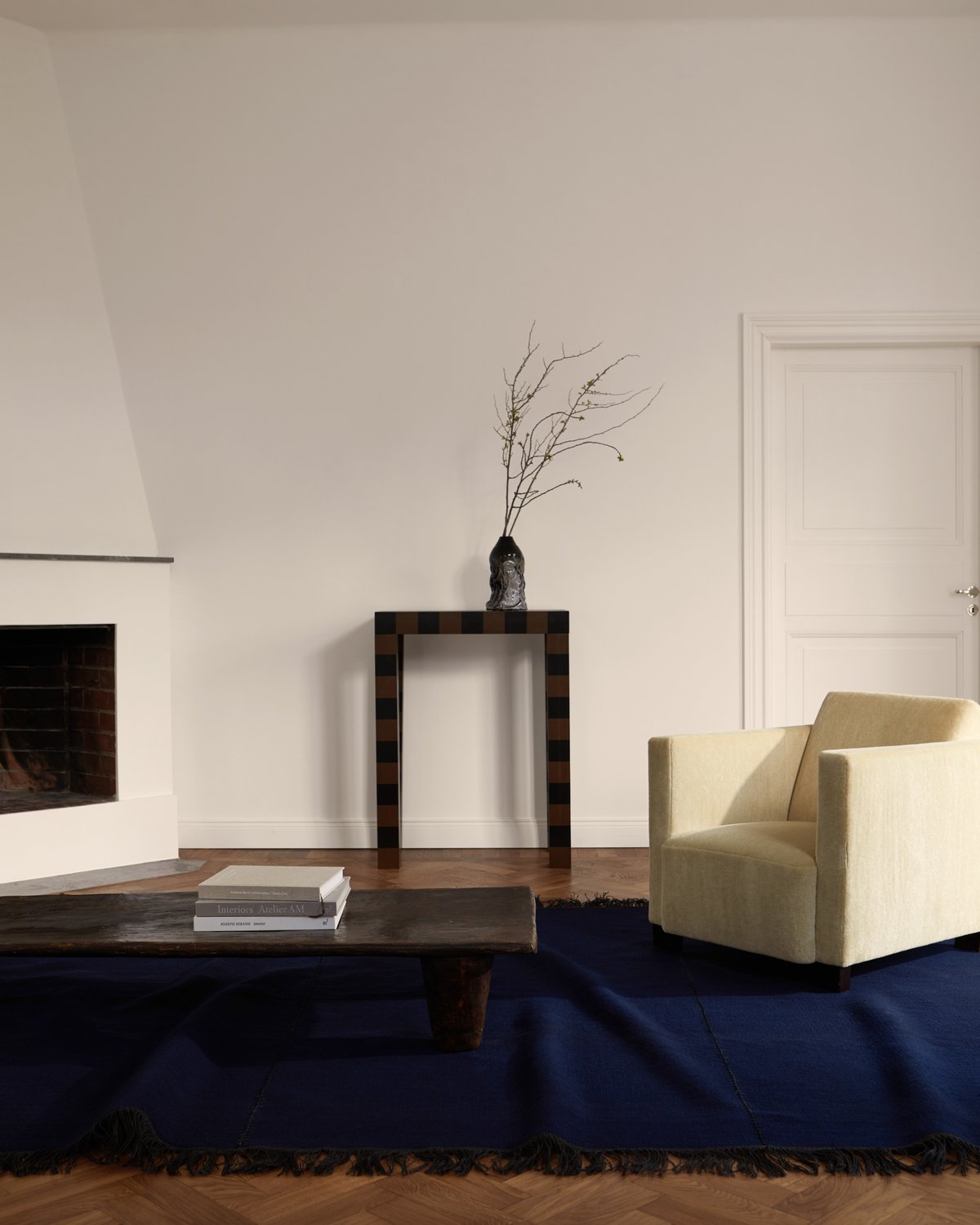 Stitches in the color indigo displayed with vintage wooden table in a modern home