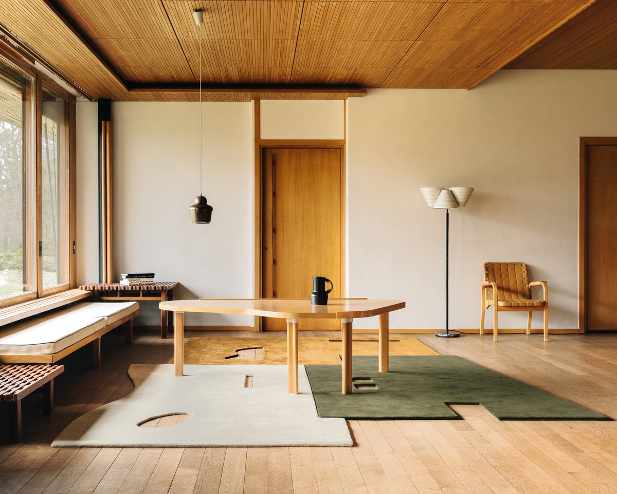 Garance Dusty White, Moss, and Leo pictured in an apartment in Paris with wooden accents.