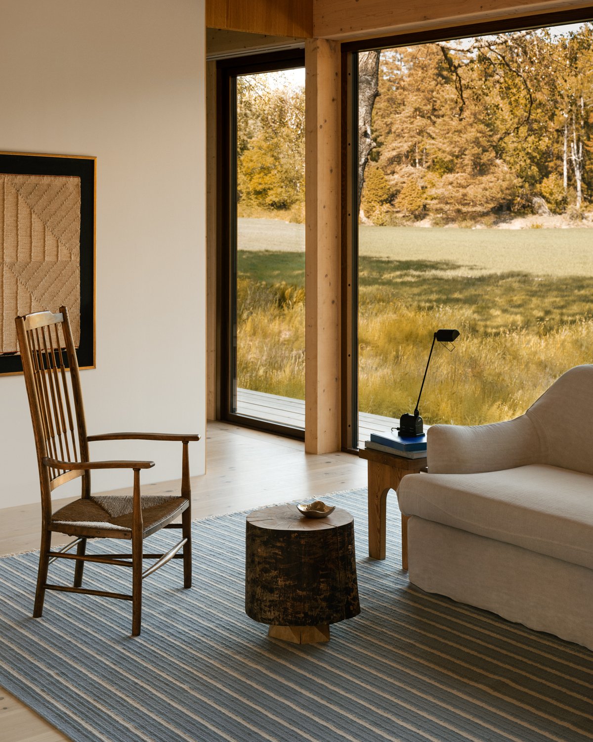 Shirt stripes in the color blue. Flatweave rug displayed in Studio He with surroundings of the nature